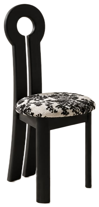 A modern black wooden chair with a unique circular cutout backrest and a black-and-white patterned upholstered seat cushion, isolated on a white background.